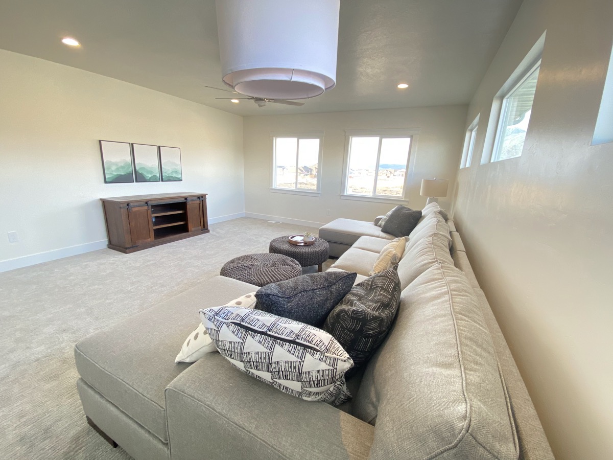 Family room viewed from behind a large sectional